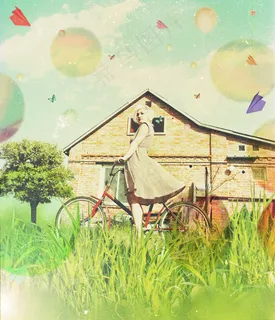 草地上骑自行车的女人图片