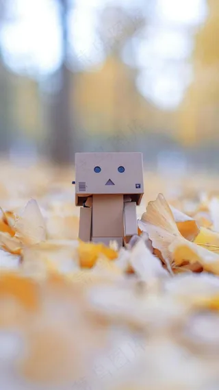 树叶上的玩具人高清摄影图片