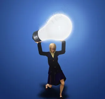 举着灯泡的机器商务美女图片 举着灯泡的机器商务美女图片