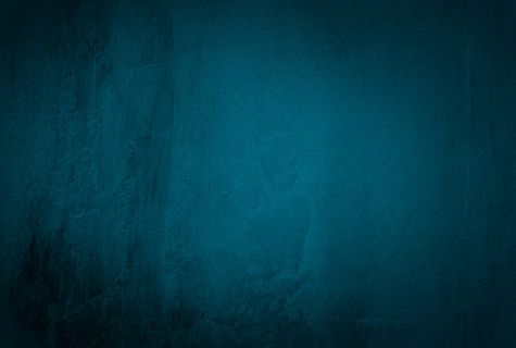 复古格伦蓝色混凝土纹理工作室墙壁背景与渐晕。