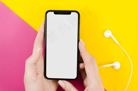 顶视图手持耳机的智能手机模型样机