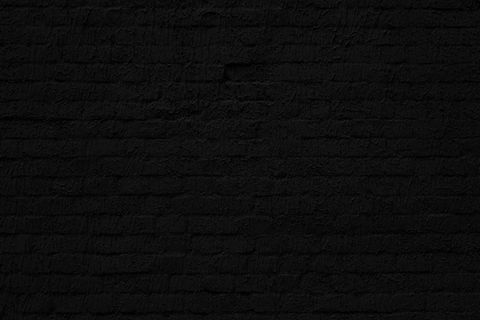 黑砖墙。阁楼室内设计。建筑背景。