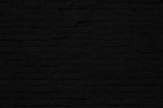 黑砖墙。阁楼室内设计。建筑背景。