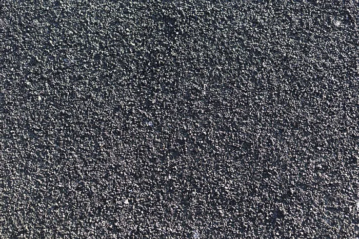 深灰色肮脏的墙面纹理背景和复制空间