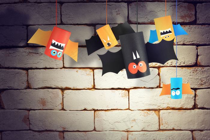 万圣节蝙蝠家庭为万圣节概念背景。纸制工艺品/diy。