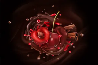 樱桃浆果和肉桂棒巧克力背景。