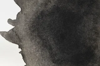 白色表面上神秘的黑色手绘污点