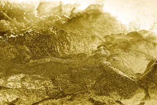 抽象的金色颠簸带纹理的背景