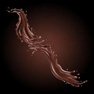 液体巧克力飞溅在黑色背景上