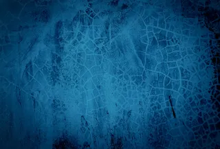 复古格伦蓝色混凝土纹理工作室墙壁背景与渐晕。