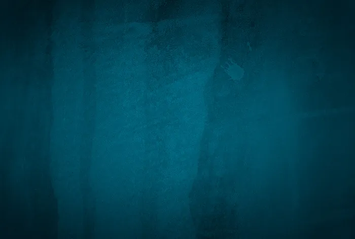 复古格伦蓝色混凝土纹理工作室墙壁背景与渐晕。
