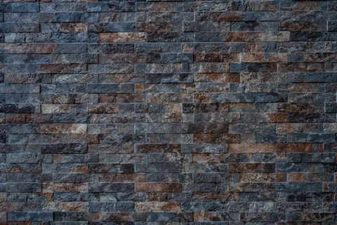 黑色与棕色砖石墙的纹理 黑色与棕色砖石墙的纹理