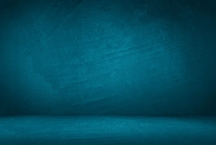 复古格伦蓝色混凝土纹理工作室墙壁背景与渐晕。