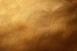 金色彩绘纹理背景。装饰面。