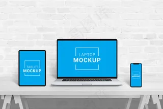 办公室中的笔记本电脑、平板电脑和手机模型样机