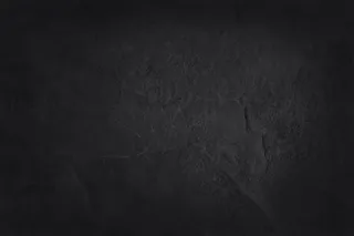 深灰色黑色板岩纹理，背景为天然黑色石墙。