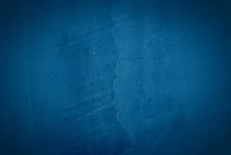 复古格伦蓝色混凝土纹理工作室墙壁背景与渐晕。