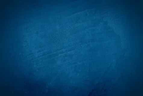 复古格伦蓝色混凝土纹理工作室墙壁背景与渐晕。