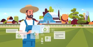 农人用平板电脑监控条件控制农产品收获组织智慧农业概念农场建筑景观背景平面水平肖像