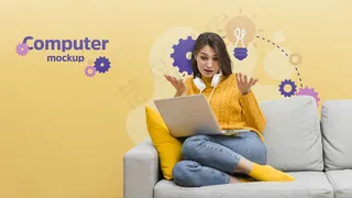 沙发上的女人在用笔记本电脑工作