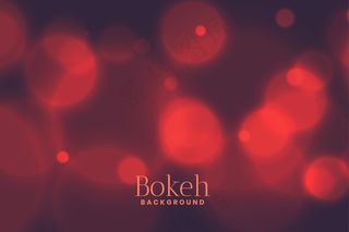 模糊的(bokeh)散景灯光效果背景，淡红色