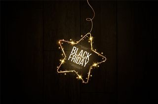 黑色星期五横幅banner。一个节日的金色，发光的框架，散落着金色的灰尘。