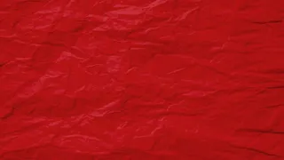 红色皱巴巴的旧纸页纹理粗糙的背景。折痕皱褶羊皮纸图案复古设计。