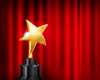 奖杯奖红幕背景写实构图，基座上金星杯形象