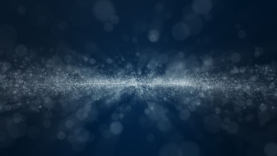 深蓝色和发光尘埃粒子抽象背景，光线照射光束效果。