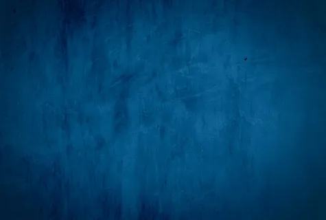 复古格伦蓝色混凝土纹理工作室墙壁背景与渐晕。