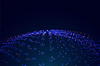 蓝色和红色背景的发光粒子抽象