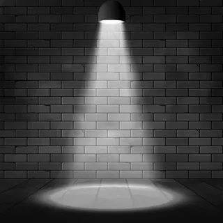 聚光灯照亮了场景和砖墙。发光效果背景。泛光灯舞台装饰