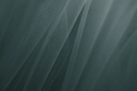 绿色薄纱窗帘带纹理的背景 绿色薄纱窗帘带纹理的背景