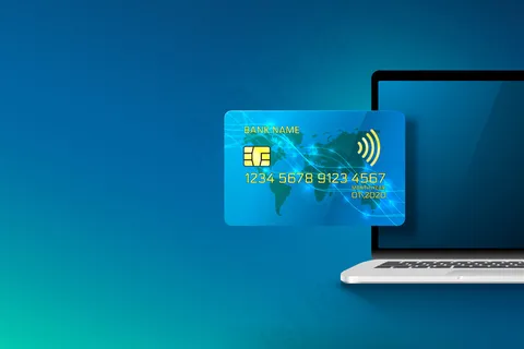 电子信用卡与计算机、金融技术、蓝色隔离。