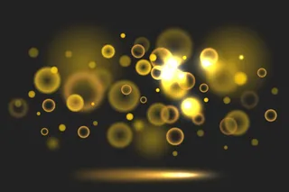 黑色背景上的Bokeh渐变金色灯光