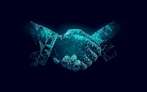 双方握手达成商业协议。