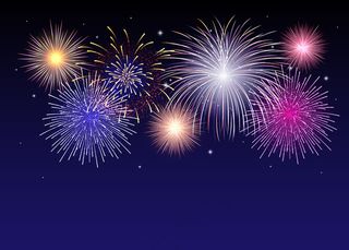 明亮的烟花在繁星点点的夜空中绽放