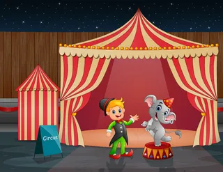 马戏团帐篷里的马戏团大象和驯兽师