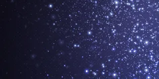 抽象的节日背景由小霓虹尘埃颗粒组成。霓虹灯。