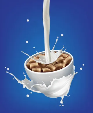 牛奶倒入碗中的蓝色背景巧克力垫飞溅的插图