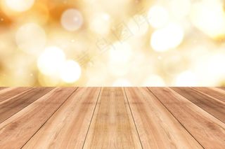 木质桌面上闪烁着闪亮的金色波基抽象背景