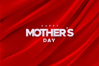 红色天鹅绒面料背景上的“母亲节快乐”标志