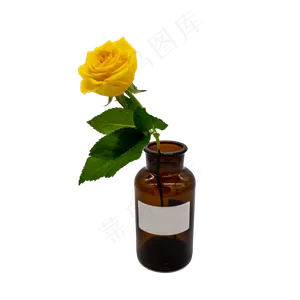 黄玫瑰和茶色玻璃瓶