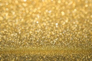 抽象的金色闪闪发光的墙壁和地板透视背景工作室与blur (bokeh)散景