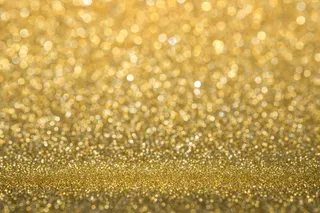 抽象的金色闪闪发光的墙壁和地板透视背景工作室与blur (bokeh)散景