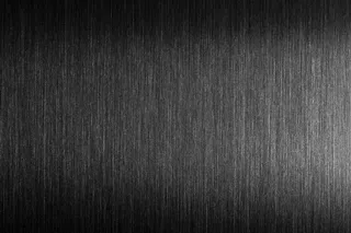 坚硬的金属。有硬反射的拉丝金属。