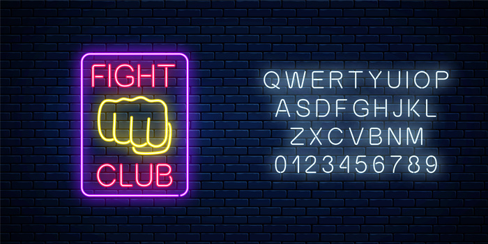 发光的霓虹灯战斗俱乐部标志，砖墙背景上有字母。