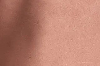 具有水泥质地的阴影粉红色背景