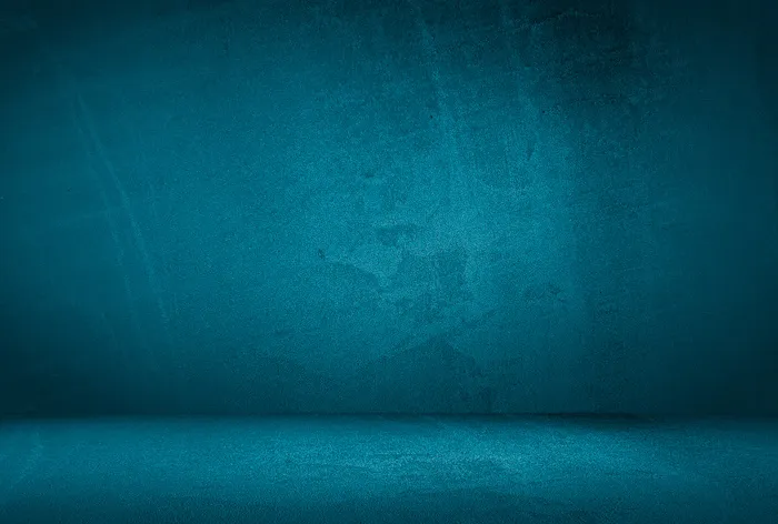 复古格伦蓝色混凝土纹理工作室墙壁背景与渐晕。