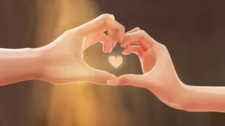 黄昏下情侣比心手势